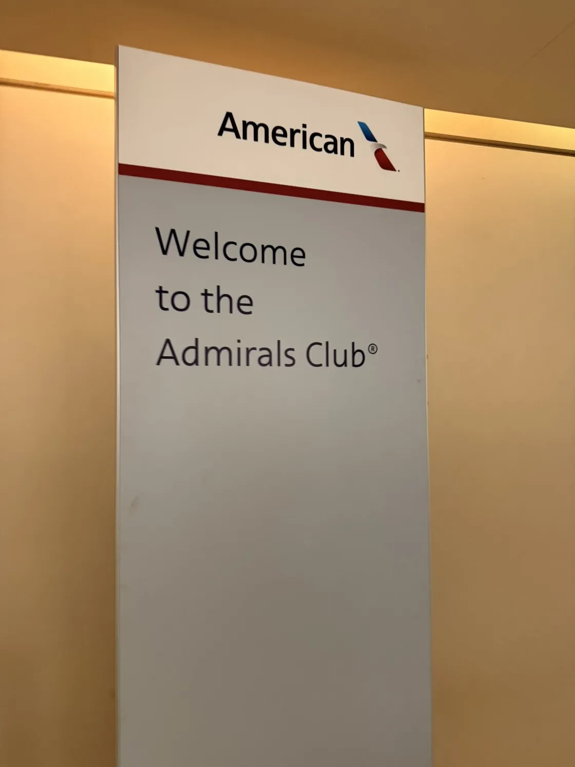American Airlines sign welcoming passengers to the Admirals Club.