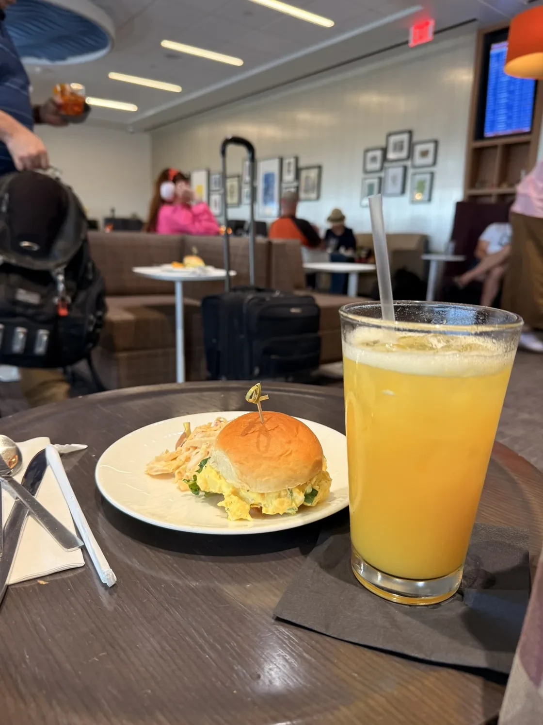 A small burger, side dishes, and a drink at the Centurion Lounge in Phoenix.